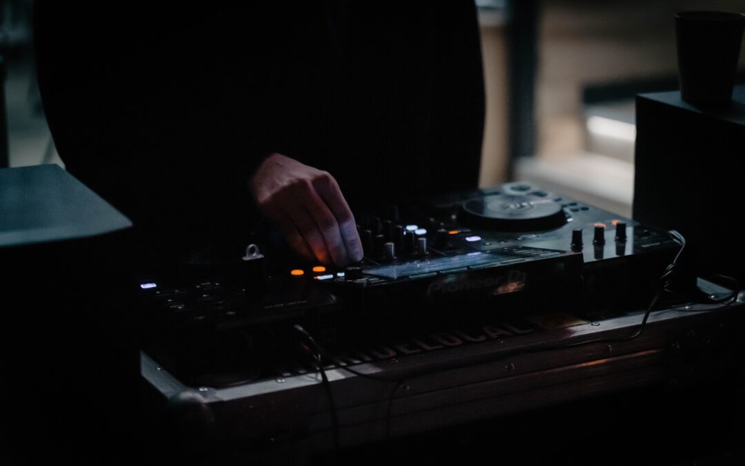 dj wearing black shirt with moody atmosphere